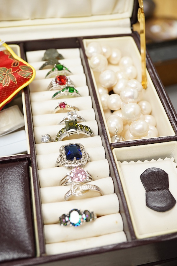 A collection of silver and other costume jewellery, including a diamond cluster ring in 9ct gold, size M, British hallmarks; a citrine ring in 9ct gold, size O, British hallmarks; a citrine ring in low carat gold, size N